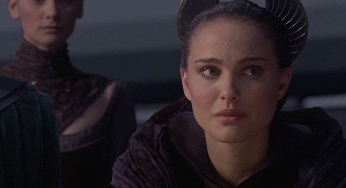 Padme in the senate chamber looking upset